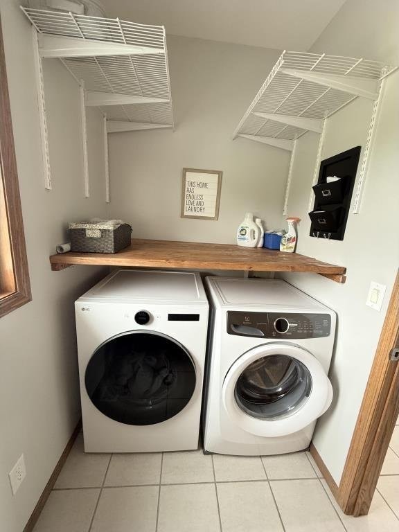 418 Michelle Ln, Walcott, IA 52773 - washroom with washing machine and dryer and tile patterned flooring