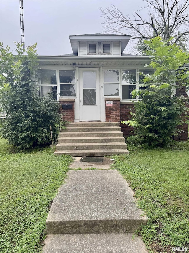 1100 E 2nd St, Centralia, IL 62801 - view of front of home with entry steps, brick siding, and a front lawn