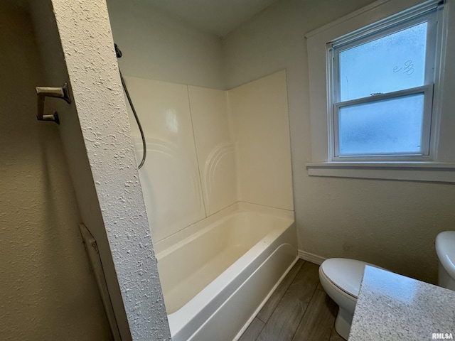 1100 E 2nd St, Centralia, IL 62801 - bathroom with wood finished floors and bathtub / shower combination