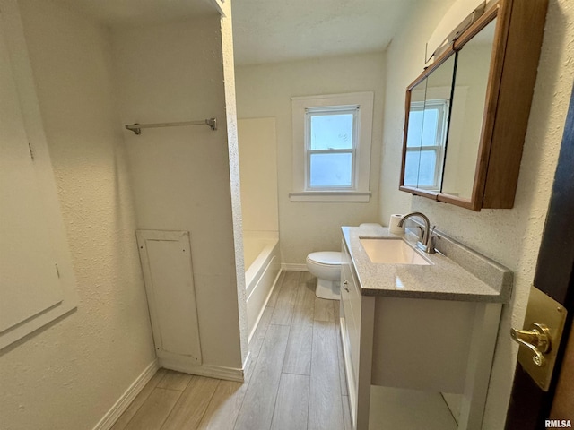 1100 E 2nd St, Centralia, IL 62801 - bathroom featuring vanity, wood finished floors, and tub / shower combination