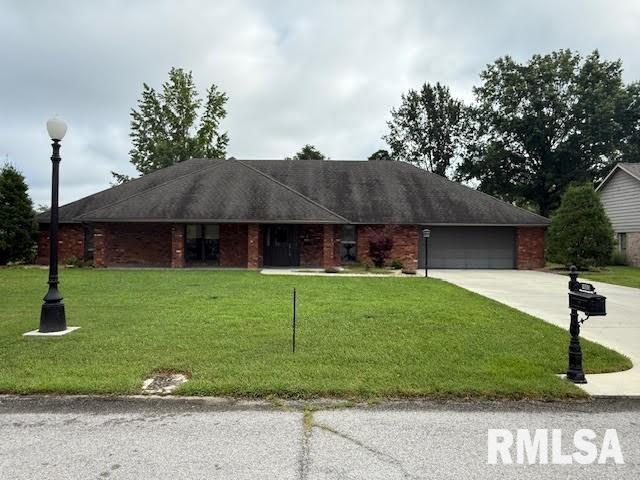 1605 S Eugene Ln, Marion, IL 62959 - ranch-style home featuring concrete driveway, a front lawn, and an attached garage