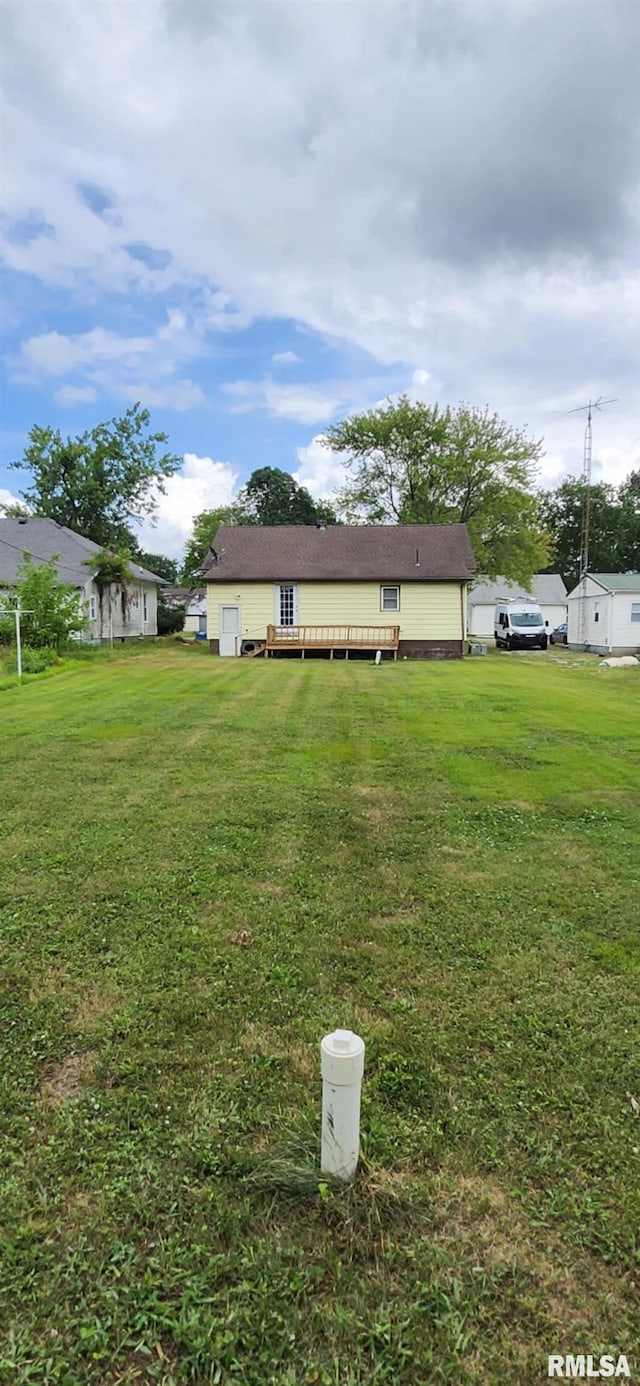 605 N Elm St, Sesser, IL 62884 - view of grassy yard featuring a deck