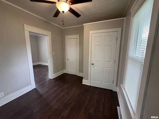 1307 S Maple St, Centralia, IL 62801 - empty room with ornamental molding, dark wood-type flooring, and a ceiling fan