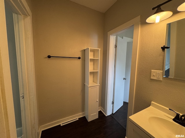 1307 S Maple St, Centralia, IL 62801 - bathroom with vanity and wood finished floors