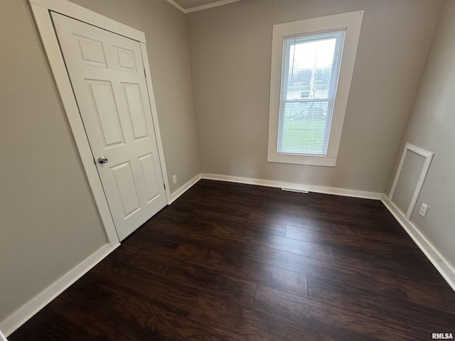 1307 S Maple St, Centralia, IL 62801 - empty room featuring dark wood finished floors and crown molding