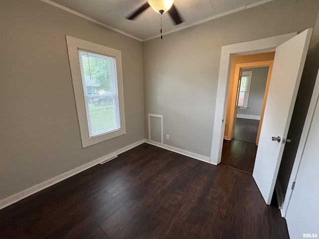 1307 S Maple St, Centralia, IL 62801 - unfurnished room with dark wood-style flooring, a ceiling fan, and crown molding