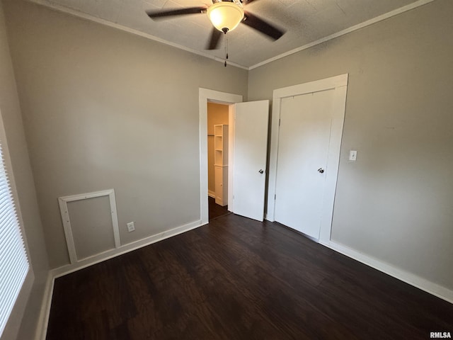 1307 S Maple St, Centralia, IL 62801 - unfurnished bedroom with dark wood finished floors, a ceiling fan, and ornamental molding