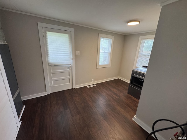 1307 S Maple St, Centralia, IL 62801 - unfurnished dining area with ornamental molding and dark wood-style floors