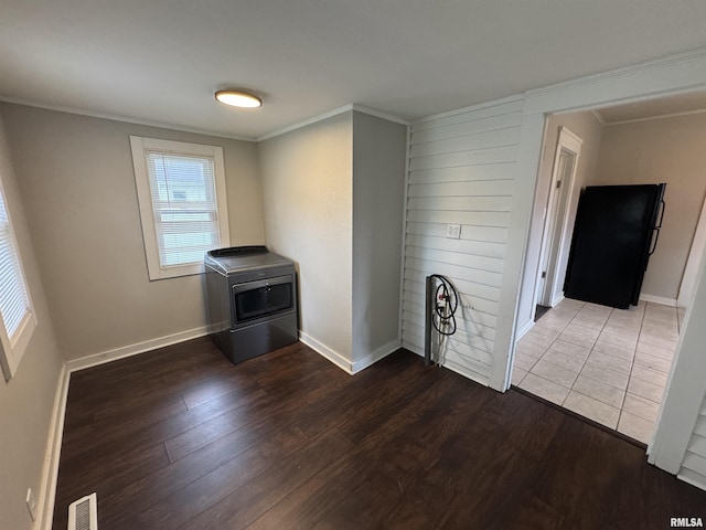 1307 S Maple St, Centralia, IL 62801 - empty room featuring washer / dryer, wood finished floors, and crown molding