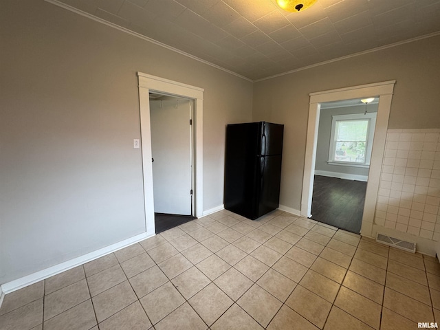 1307 S Maple St, Centralia, IL 62801 - spare room featuring ornamental molding and light tile patterned floors