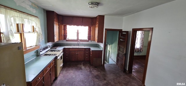 232 N James Ave, Centralia, IL 62801 - kitchen featuring gas range gas stove, refrigerator, and light countertops
