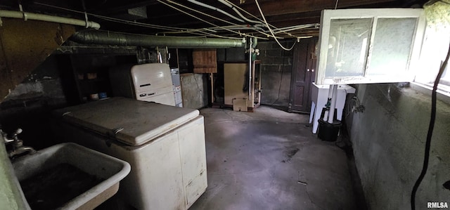 232 N James Ave, Centralia, IL 62801 - below grade area featuring a sink and gas water heater