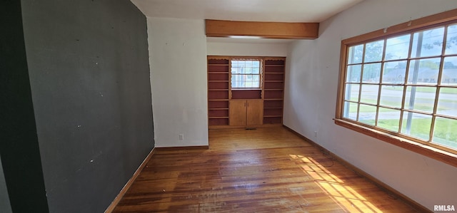 232 N James Ave, Centralia, IL 62801 - spare room featuring wood finished floors, healthy amount of natural light, and built in shelves