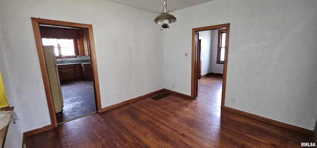 232 N James Ave, Centralia, IL 62801 - empty room featuring dark wood-style flooring