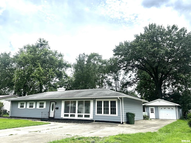 6 Charles Dr, Centralia, IL 62801 - ranch-style home with an outdoor structure, a detached garage, a chimney, concrete driveway, and a front lawn