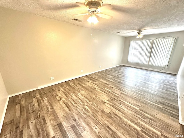 6 Charles Dr, Centralia, IL 62801 - unfurnished room featuring ceiling fan, a textured ceiling, and wood finished floors