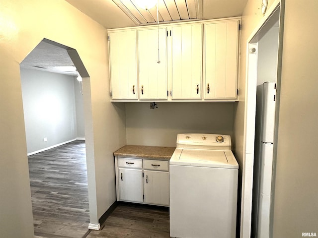 6 Charles Dr, Centralia, IL 62801 - washroom with washer / clothes dryer, cabinet space, dark wood-type flooring, and arched walkways