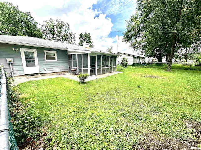 6 Charles Dr, Centralia, IL 62801 - view of green lawn with a sunroom and a patio area
