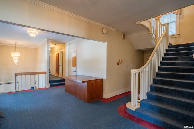 stairs with dark colored carpet, ornamental molding, and a chandelier