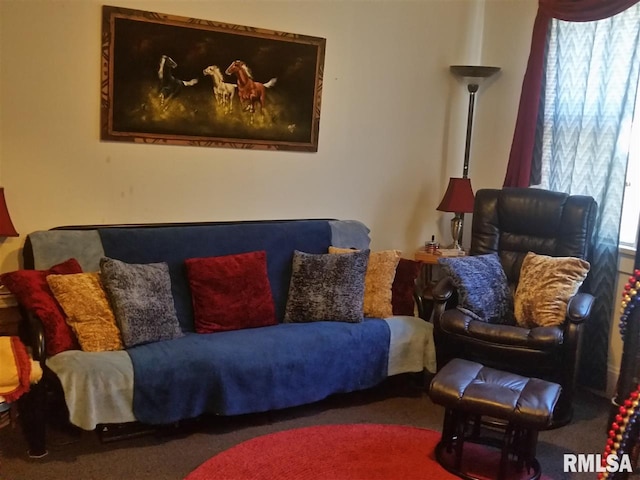 living room featuring carpet floors and a healthy amount of sunlight