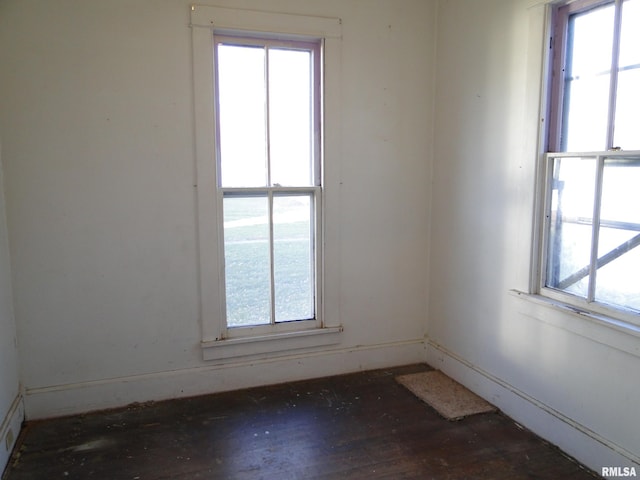 empty room with hardwood / wood-style flooring