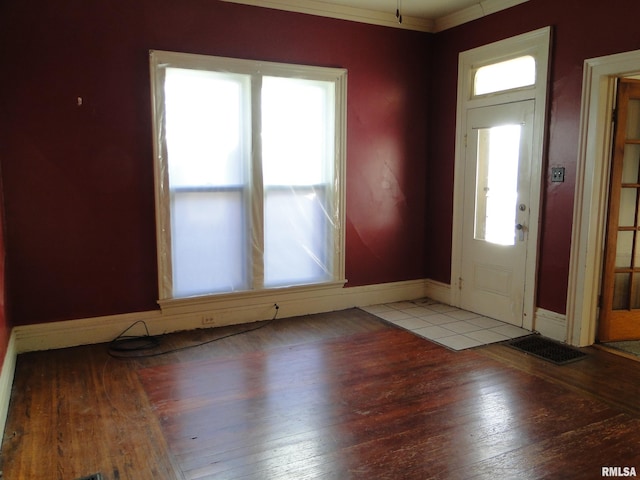 tiled foyer with crown molding