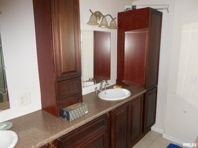 bathroom with tile flooring, double sink, and oversized vanity