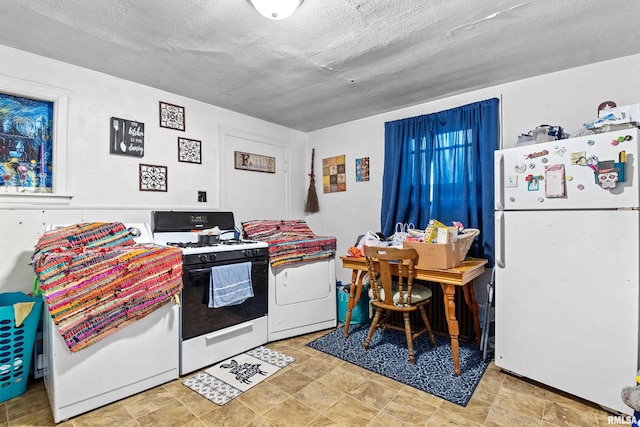 kitchen with white appliances, a textured ceiling, and light tile floors