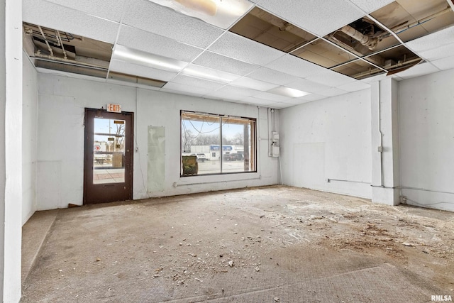 unfurnished room featuring a paneled ceiling