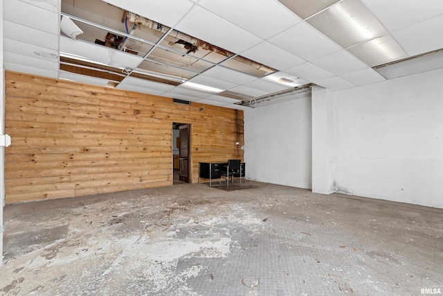 interior space with a paneled ceiling