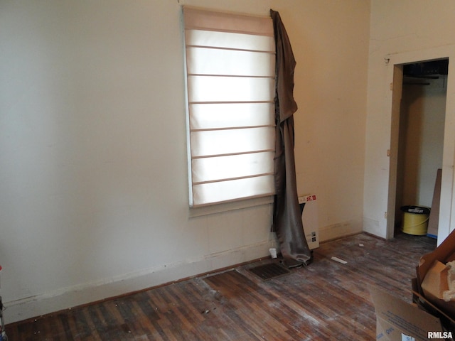 unfurnished bedroom featuring dark wood-type flooring