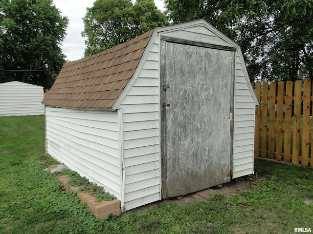 view of outbuilding with a lawn