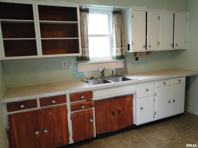 kitchen with white cabinetry and sink