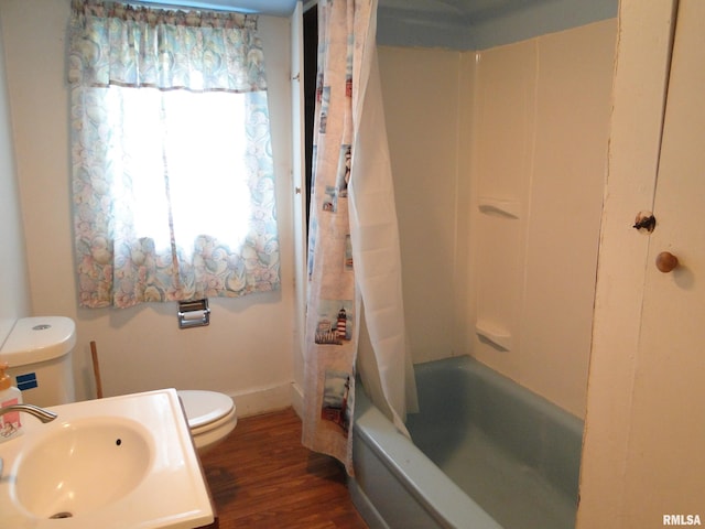 full bathroom with wood-type flooring, vanity, toilet, and shower / bathtub combination with curtain