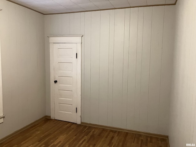 empty room with hardwood / wood-style flooring