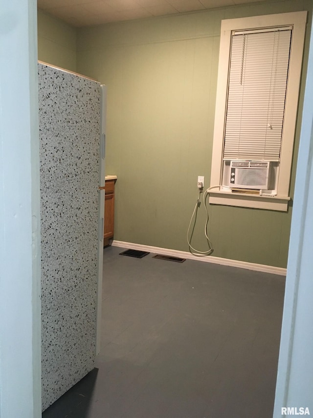 bathroom featuring cooling unit and concrete flooring