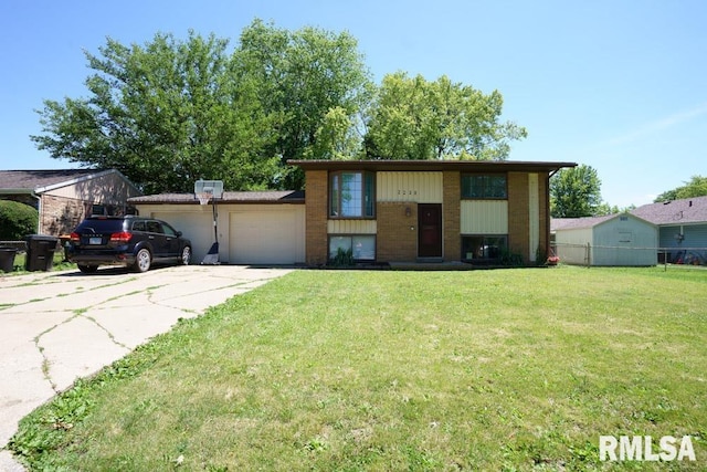 raised ranch with a front yard and a garage