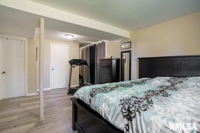 bedroom with light hardwood / wood-style floors