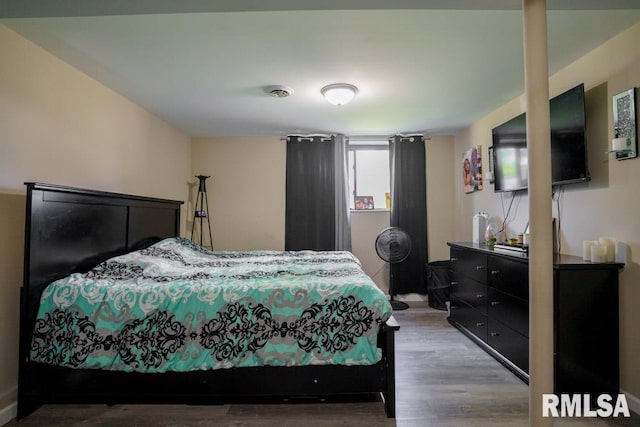 bedroom featuring hardwood / wood-style floors