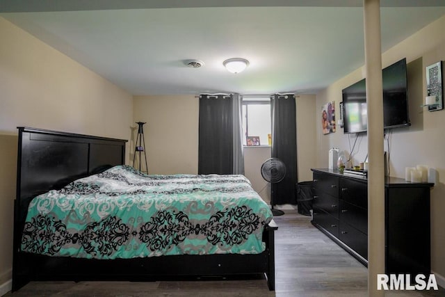 bedroom with light wood-type flooring