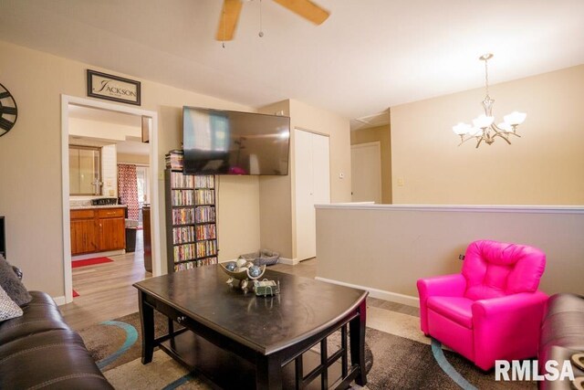 living room with a wealth of natural light and ceiling fan