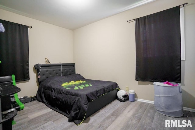 bedroom featuring wood-type flooring