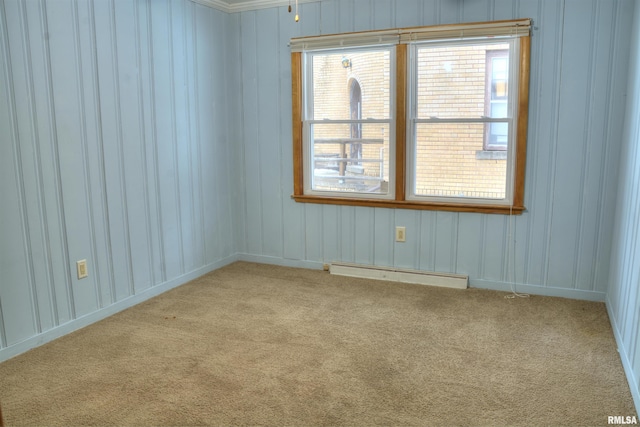 carpeted spare room with baseboard heating