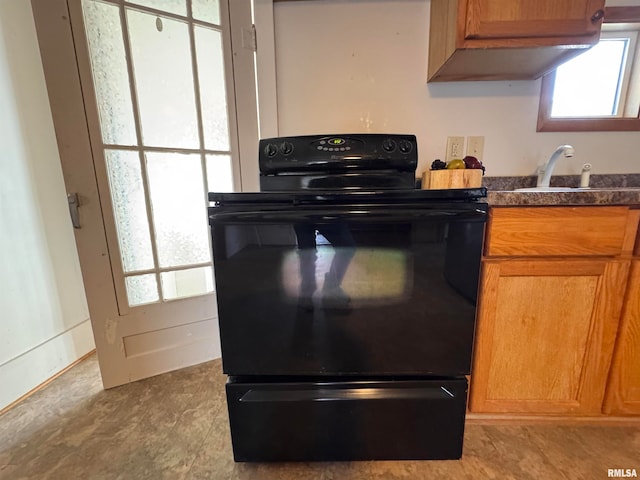 kitchen featuring black electric range and sink