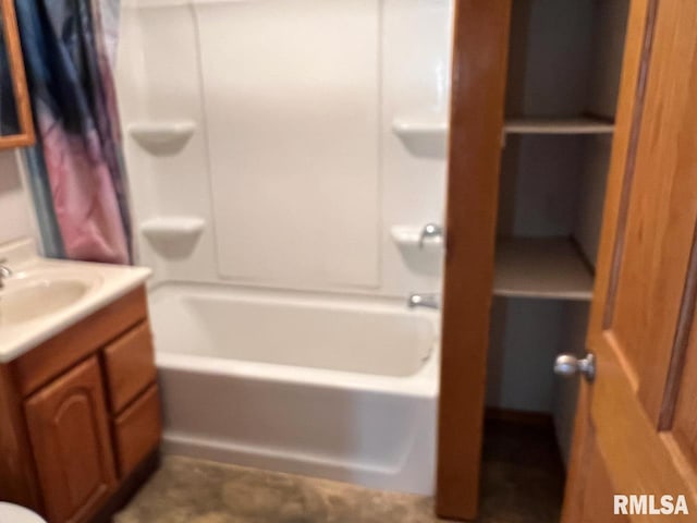 bathroom with shower / bath combo and vanity