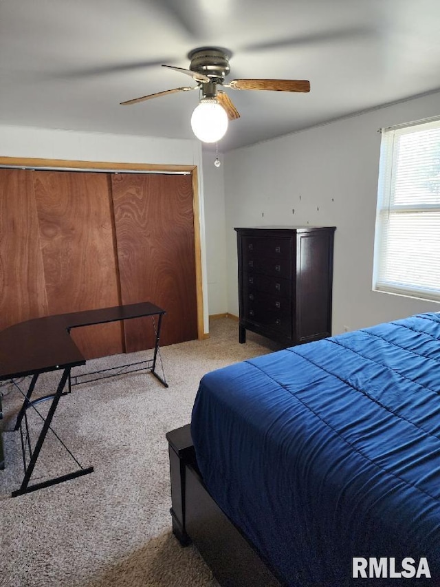 carpeted bedroom with ceiling fan