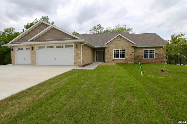 view of front of house featuring a front lawn and a garage