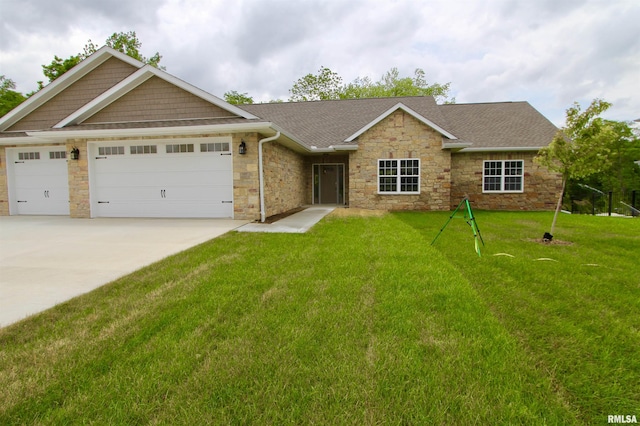 view of front of house with a garage and a front lawn