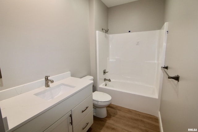 full bathroom with vanity,  shower combination, toilet, and wood-type flooring