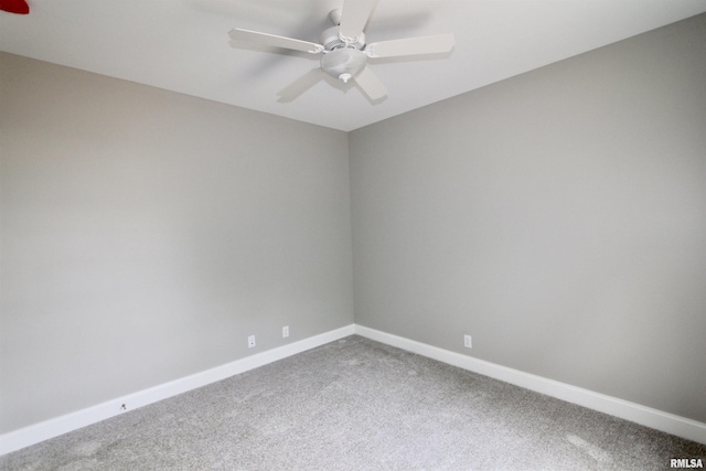 spare room with carpet and ceiling fan